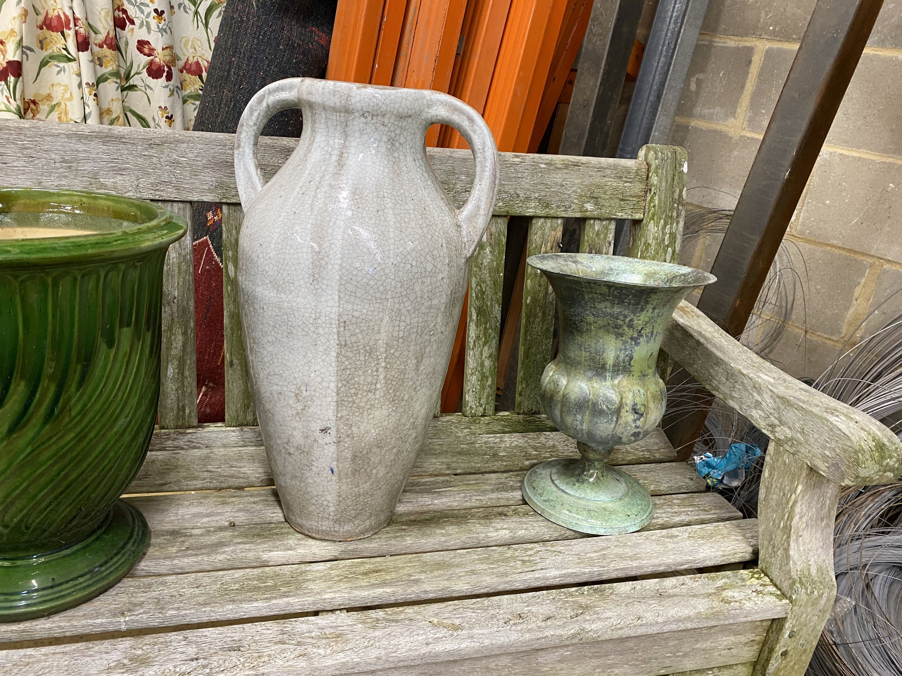 A reconstituted stone circular garden bird bath, diameter 40cm, height 67cm together with two garden planters
